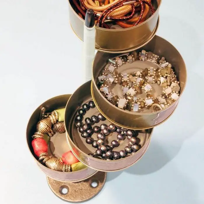 You can use this to store jewelry, office supplies, or other trinkets!DIY Swivel Storage Tower from Tuna Cans 