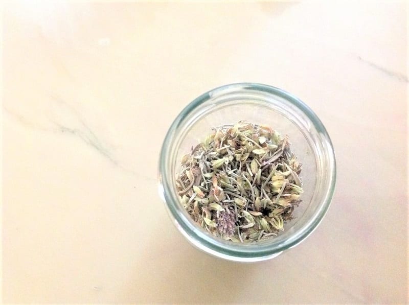 Once the lavender stalks are dry, crumble them apart with your fingers. 