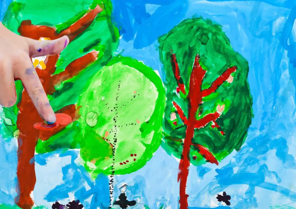 Through finger painting, children are able to express themselves creatively.