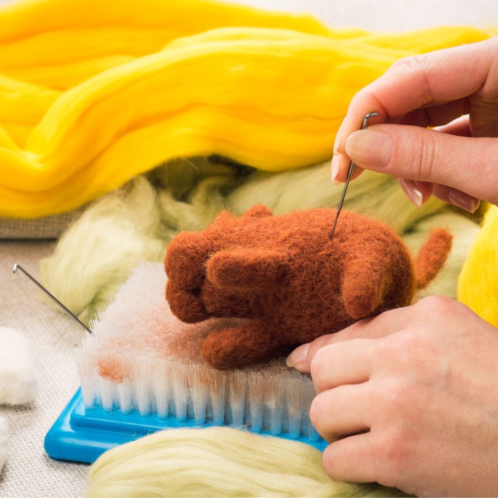 In needle felting, sculpting refers to the process of manipulating wool in order to produce diverse shapes and forms.