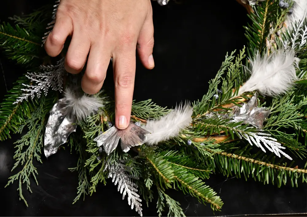 Engaging in a DIY project like making a winter wreath provides a therapeutic escape.