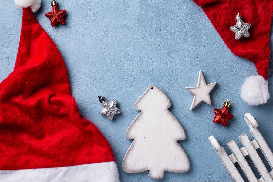 An image of Santa hats and decorations on the floor. 