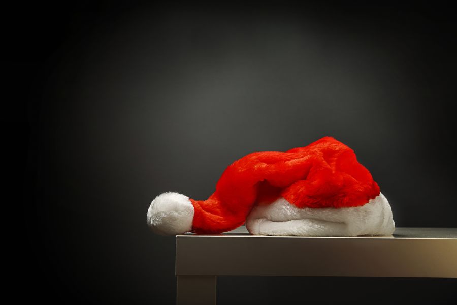 An image of a Santa hat on a table. 