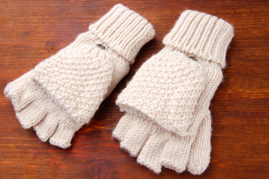 An image of white fingerless gloves.