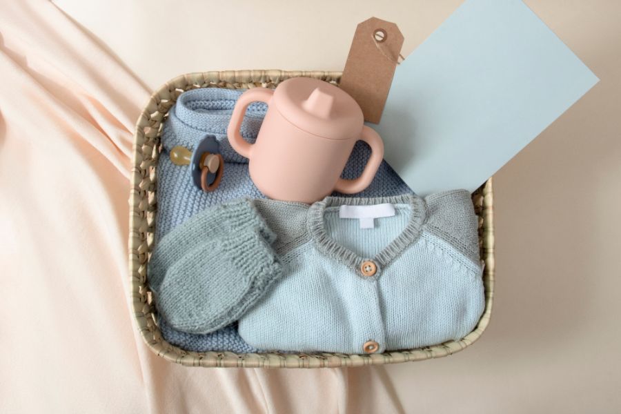 An image of baby gifts in a gift basket. 